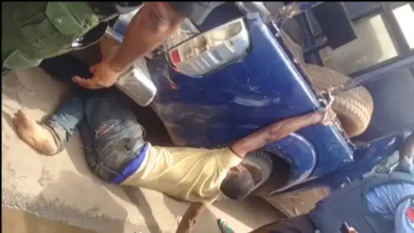 Strange Policemen Chain Young Man To The Back Of Their Hilux, Drag Him Along The Road {See Why/Photos}